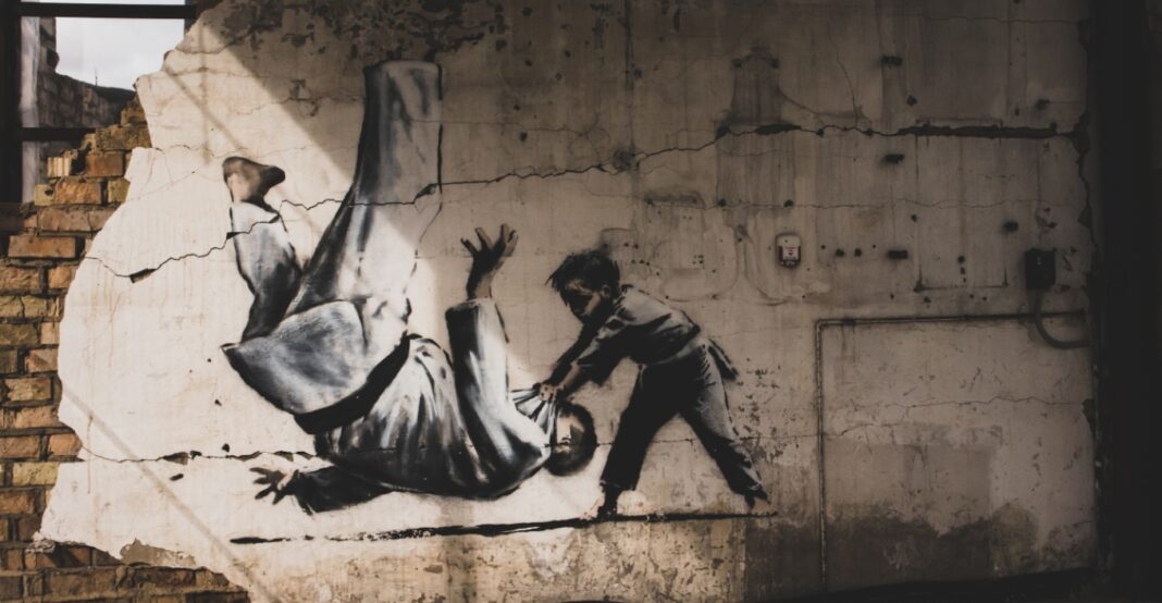 The media may have unmasked Banksy -again. That’s angered some art fans but not ruffled dealers -Video